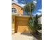 Spacious two-car garage featuring well-maintained landscaping in a residential neighborhood at 508 Royal Tree Ln, Oviedo, FL 32765