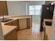 Kitchen with a view to dining area, showing light wood cabinetry at 508 Royal Tree Ln, Oviedo, FL 32765