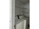 Convenient laundry room equipped with a washer, dryer, and shelving at 508 Royal Tree Ln, Oviedo, FL 32765