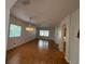 Bright living area featuring hardwood floors and a decorative chandelier at 508 Royal Tree Ln, Oviedo, FL 32765
