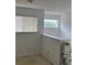 Loft with two windows and a chairlift on the stairway landing at 508 Royal Tree Ln, Oviedo, FL 32765