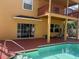 Backyard pool and patio with a second-story porch perfect for outdoor enjoyment and entertaining at 508 Royal Tree Ln, Oviedo, FL 32765