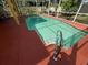 Outdoor swimming pool with a concrete deck, metal handrail, and tile details at 508 Royal Tree Ln, Oviedo, FL 32765