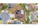 Aerial view of a single-Gathering home featuring a solar panel roof and screened-in patio in a residential neighborhood at 5113 Sage Way, Kissimmee, FL 34758