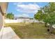 Spacious back yard enclosed by a white privacy fence at 5113 Sage Way, Kissimmee, FL 34758