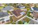Aerial view of a house featuring a fenced-in backyard, screened-in patio and well maintained landscaping at 5113 Sage Way, Kissimmee, FL 34758