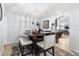 Dining area features a modern chandelier and view into the living room at 5113 Sage Way, Kissimmee, FL 34758