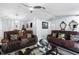 Living room showcasing comfortable seating, neutral paint and decor, with modern ceiling fan at 5113 Sage Way, Kissimmee, FL 34758
