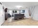 Spacious living room with tile flooring, ceiling fan, and neutral paint at 5113 Sage Way, Kissimmee, FL 34758