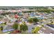 Aerial view of a residential neighborhood with mature trees and well-maintained lawns at 5113 Sage Way, Kissimmee, FL 34758