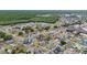 Aerial view of a residential neighborhood with single Gathering homes near a forest at 5113 Sage Way, Kissimmee, FL 34758