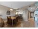 Cozy dining area with seating for six and an open view to the kitchen at 5300 S Atlantic Ave # 16-505, New Smyrna Beach, FL 32169