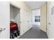 Hallway with storage closet and doors, offering practical space for residents at 5300 S Atlantic Ave # 16-505, New Smyrna Beach, FL 32169