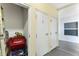 Hallway with storage closet and doors, offering practical space for residents at 5300 S Atlantic Ave # 16-505, New Smyrna Beach, FL 32169