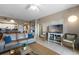 Inviting living room with a relaxing seating area and a view of the kitchen at 5300 S Atlantic Ave # 16-505, New Smyrna Beach, FL 32169