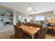 Comfortable open living space with modern decor, a dining area, and a view of other rooms at 5300 S Atlantic Ave # 16-505, New Smyrna Beach, FL 32169