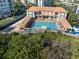 Aerial view of a shared pool and patio area featuring a large pool and various seating options at 5300 S Atlantic Ave # 16-505, New Smyrna Beach, FL 32169