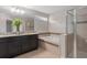 Bathroom featuring double vanity, soaking tub, and glass enclosed shower at 540 Seven Oaks Blvd, Winter Springs, FL 32708