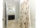 Bathroom with tub and shower combo and views into the double vanity at 540 Seven Oaks Blvd, Winter Springs, FL 32708