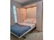 Efficient bedroom with Murphy bed cabinet for storage and flexible use at 540 Seven Oaks Blvd, Winter Springs, FL 32708