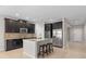 Modern kitchen with dark cabinetry, granite countertops, and stainless steel appliances at 540 Seven Oaks Blvd, Winter Springs, FL 32708
