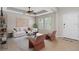 Bright living room with neutral tones, modern furniture, and ample natural light at 540 Seven Oaks Blvd, Winter Springs, FL 32708