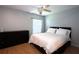 Bedroom with hardwood flooring, ceiling fan, dresser and a queen bed at 613 Casa Park Court B N Ct # B, Winter Springs, FL 32708