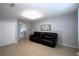 Spacious living room with tile floors, leather seating, and neutral wall colors at 613 Casa Park Court B N Ct # B, Winter Springs, FL 32708