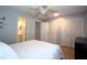 Bedroom boasts wood floors, ceiling fan, closet doors, and an en-suite bathroom at 613 Casa Park Court B N Ct # B, Winter Springs, FL 32708