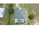 Aerial view of a property showcasing the home and pool at 7017 Bridle Path, St Cloud, FL 34771