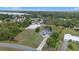 Aerial view of house nestled among trees with a pool at 7017 Bridle Path, St Cloud, FL 34771