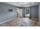 Neutral bedroom offering tile floors, a ceiling fan, and a window overlooking the pool at 7017 Bridle Path, St Cloud, FL 34771