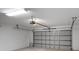 Spacious garage with high ceilings and overhead door at 7017 Bridle Path, St Cloud, FL 34771