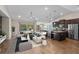 Bright, open living space featuring a stylish kitchen, dining area, and a view of the pool at 7017 Bridle Path, St Cloud, FL 34771