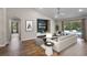 Elegant living room with a view of the pool, featuring modern decor and ample natural light at 7017 Bridle Path, St Cloud, FL 34771