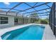 Sparkling pool and spa are enclosed within a large screened enclosure at 7017 Bridle Path, St Cloud, FL 34771