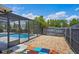 Backyard pool area with a playful design is great for families at 7017 Bridle Path, St Cloud, FL 34771