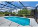 Enjoy this screened-in pool, perfect for swimming laps in privacy at 7017 Bridle Path, St Cloud, FL 34771
