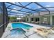 Screened pool deck area with pool, spa, and exterior dining set at 7017 Bridle Path, St Cloud, FL 34771