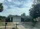 Lovely single-story home with an attached garage, nestled in a suburban landscape at 7614 Brisbane Ct, Orlando, FL 32835