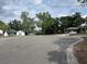 A serene street view showcasing well-maintained homes and lush greenery at 7614 Brisbane Ct, Orlando, FL 32835