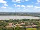 Aerial view showcasing the lakeside community with a ferris wheel on the horizon at 8539 Via Bella Notte, Orlando, FL 32836