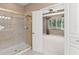 Bathroom with a glass shower stall and a doorway to a bedroom with an open window at 8539 Via Bella Notte, Orlando, FL 32836