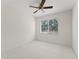 Bedroom with white walls and carpet and a ceiling fan and a window at 8539 Via Bella Notte, Orlando, FL 32836
