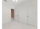 Bedroom with white walls and carpeted floor, with a door to another room in the house at 8539 Via Bella Notte, Orlando, FL 32836