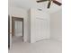 Bedroom with doors to other rooms in the house and a double door closet with white paint at 8539 Via Bella Notte, Orlando, FL 32836