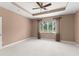 Bedroom with a ceiling fan and natural light from the window at 8539 Via Bella Notte, Orlando, FL 32836