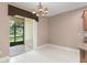 Tiled dining room with large windows and sliding glass doors at 8539 Via Bella Notte, Orlando, FL 32836
