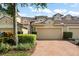 Home with brick driveway, neutral color scheme, and manicured shrubbery at 8539 Via Bella Notte, Orlando, FL 32836