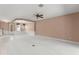 Open living room with carpet, a chandelier, and a staircase at 8539 Via Bella Notte, Orlando, FL 32836
